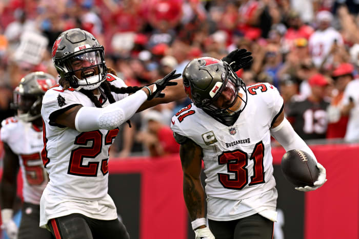 Tampa Bay Buccaneers defensive back Antoine Winfield Jr. (31) celebrates with defensive back Ryan Neal (23) after an interception in the second half against the Tennessee Titans Raymond James Stadium.